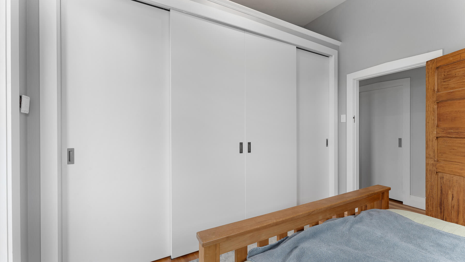 Flush Panel sliding wardrobe doors, four on a double track, in white