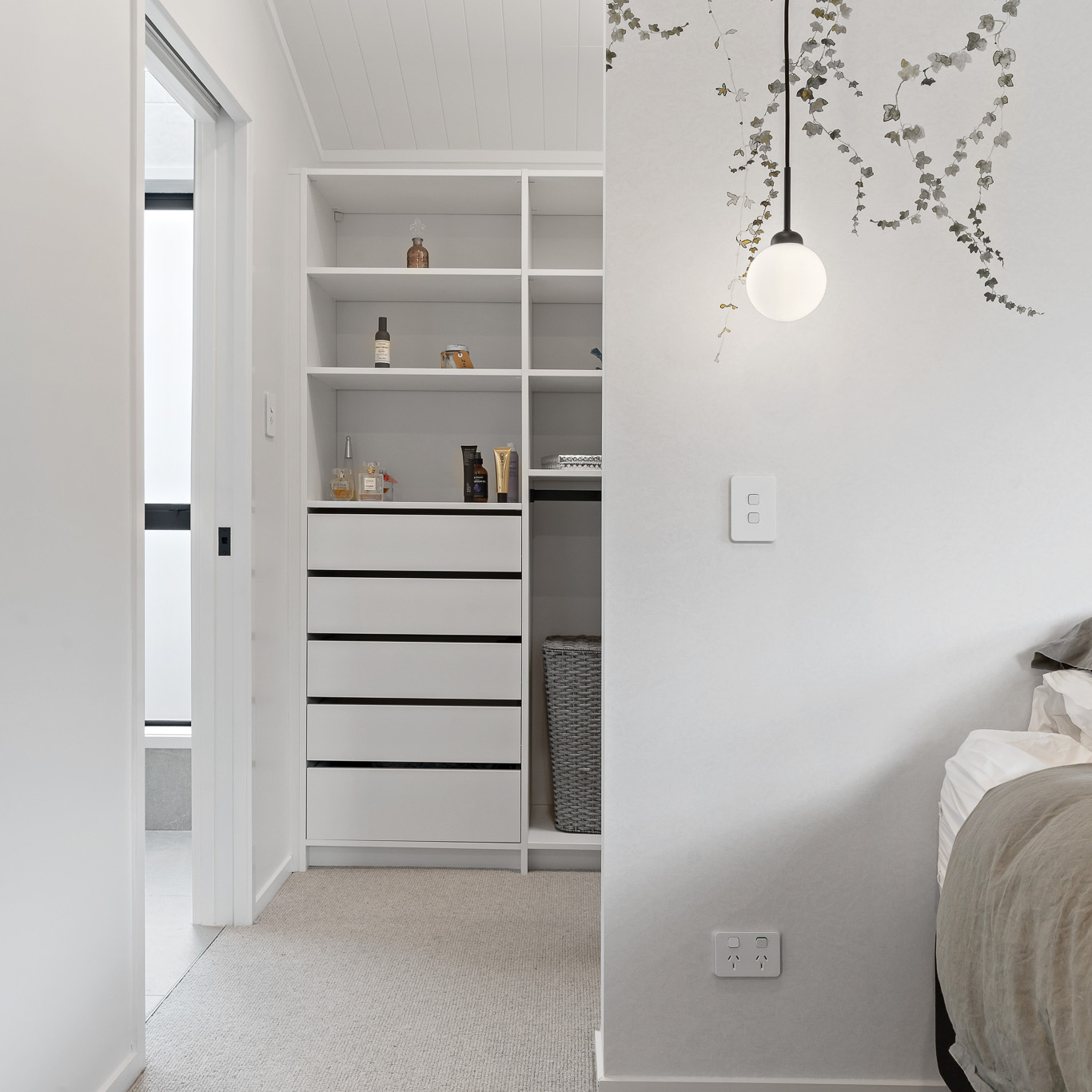Bedroom with a White Flex wardrobe organiser walk-in behind the bed