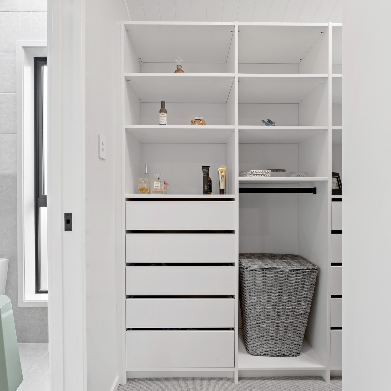 Image of White Flex wardrobe organiser walk-in, you can also see the on-suite next to it