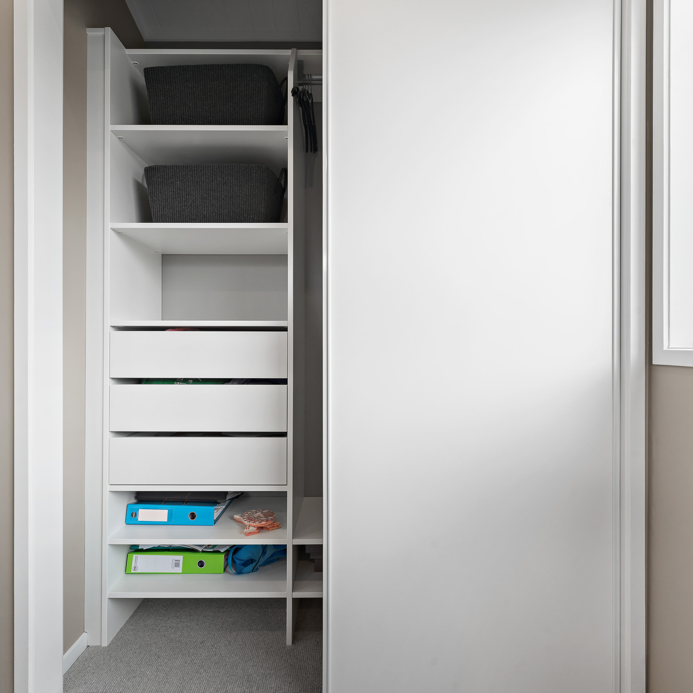 White Flex Wardrobe organiser with Aristo sliding wardrobe doors, doors are open and you can see inside the wardrobe