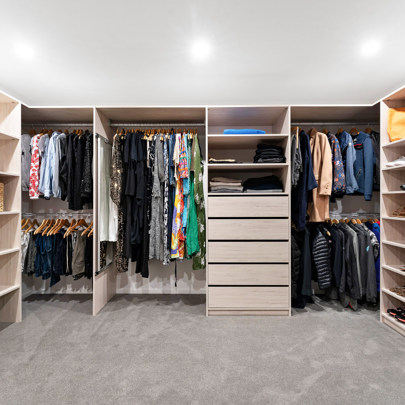 Flex walk-in wardrobe organiser in light woodgrain colour, wide shot showing another angle of the large space